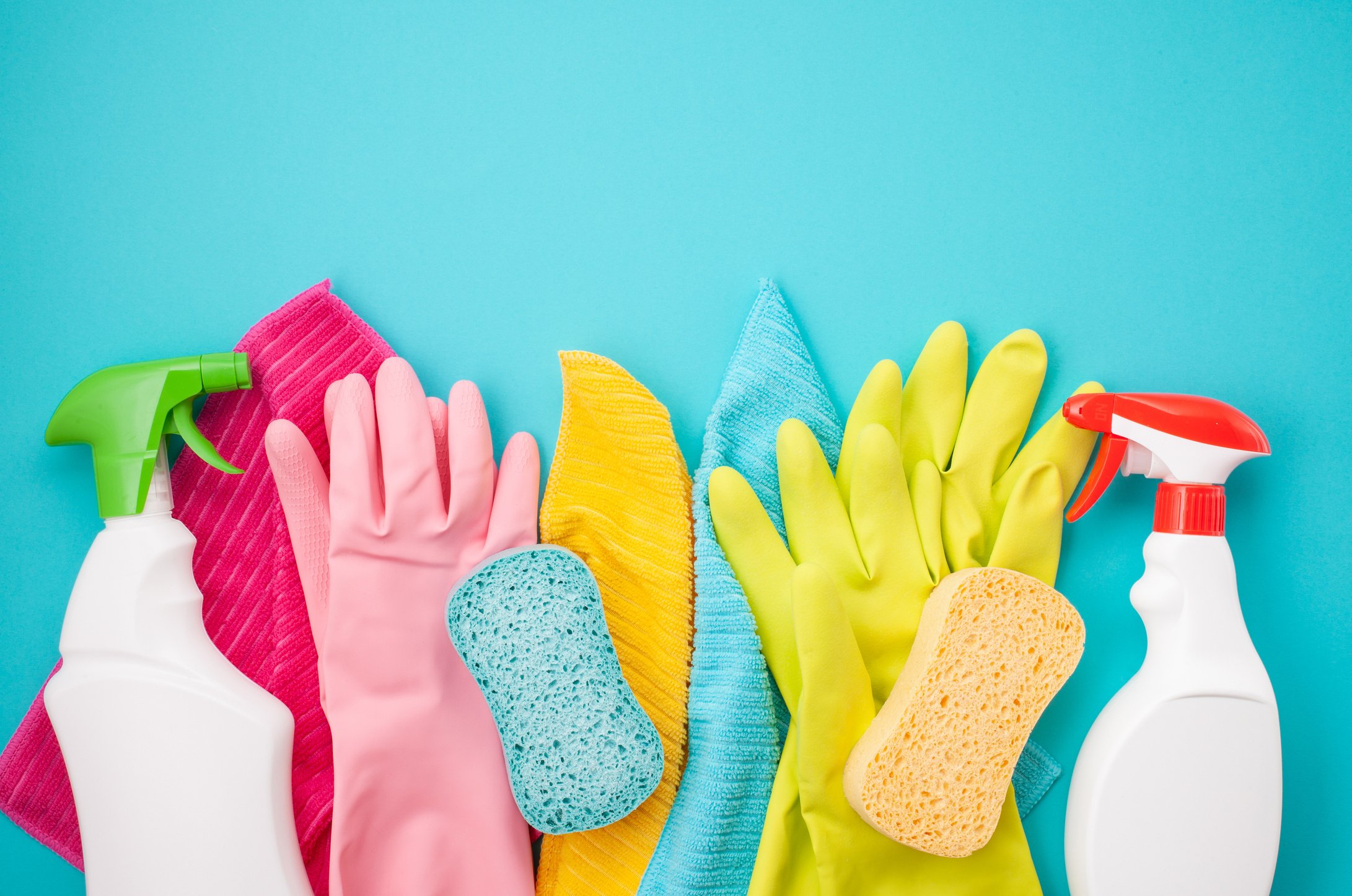 Detergents and cleaning accessories in pastel color. Cleaning service, small business idea. Top view.